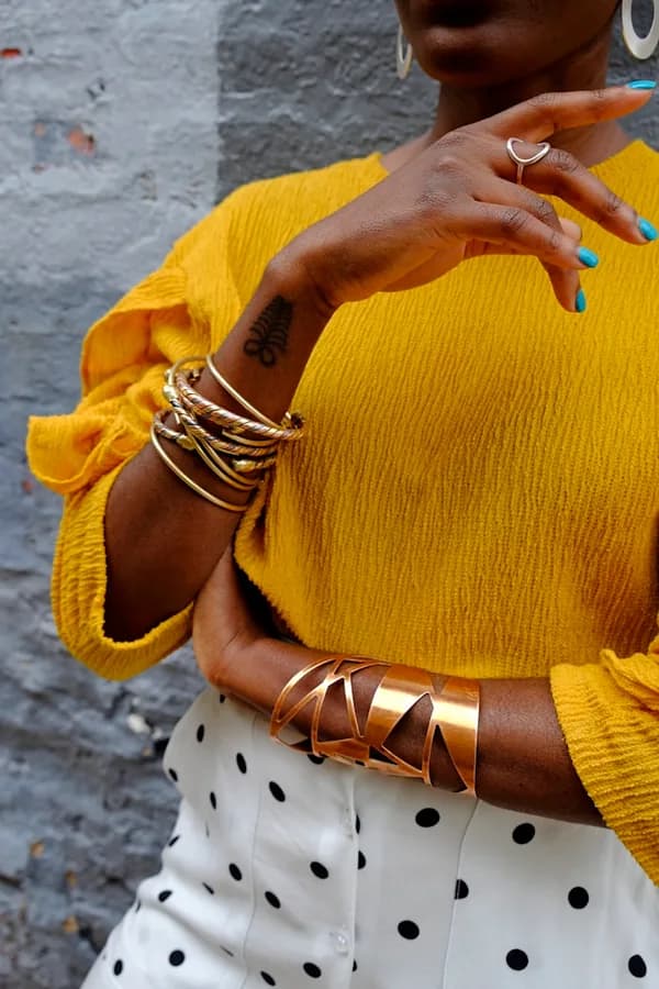 Arm wearing gold bangles