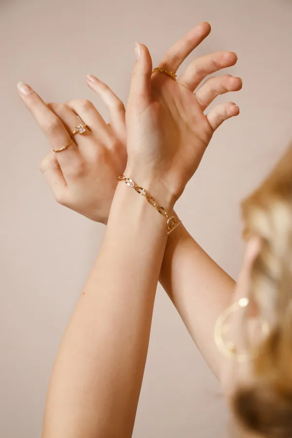 Hands wearing stacked rings